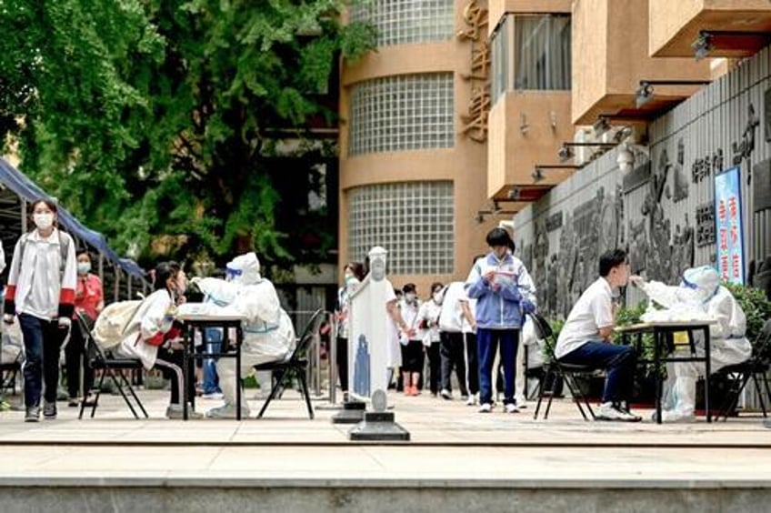 schools in china reportedly isolate students as covid cases surge