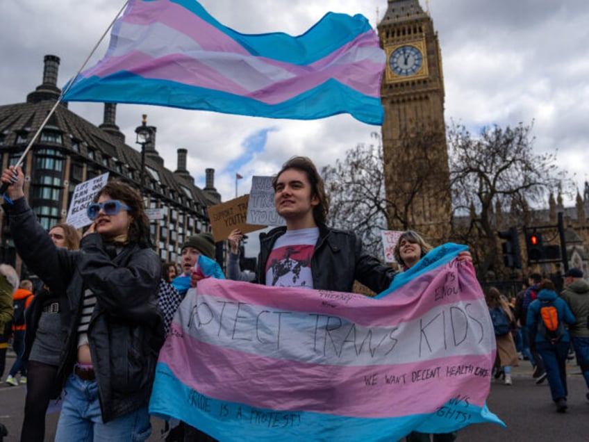 LONDON, ENGLAND - APRIL 20: Trans rights activists take part in a protest against the ban