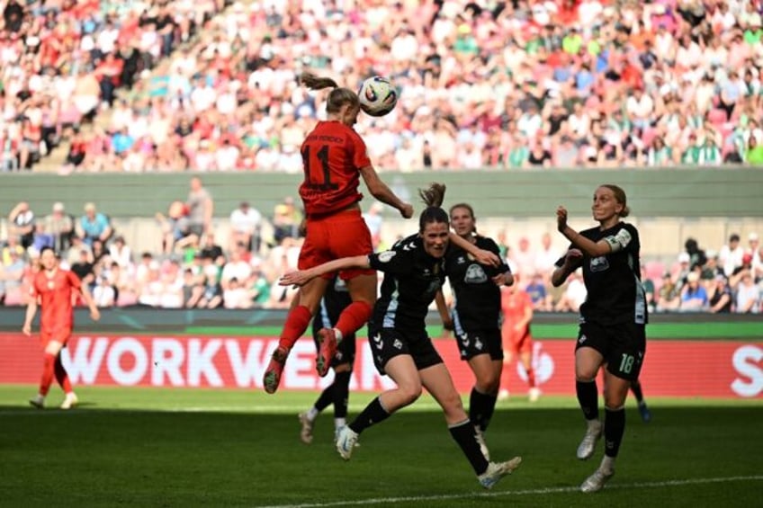Lea Schueller (C) heads home Bayern Munich's third goal in their 4-2 German Cup final win