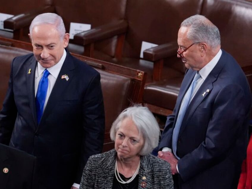 Israeli Prime Minister Benjamin Netanyahu, top left, walks past Senate Majority Leader Chu