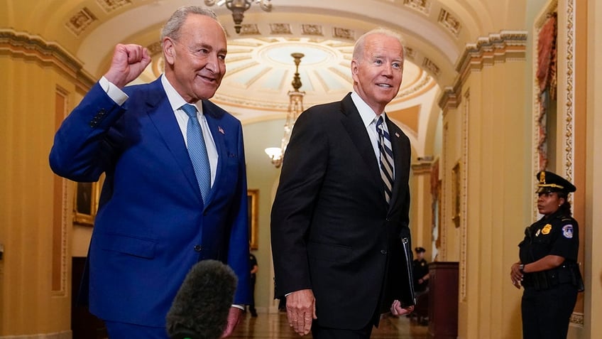 Chuck Schumer and Joe Biden walking in the Capitol