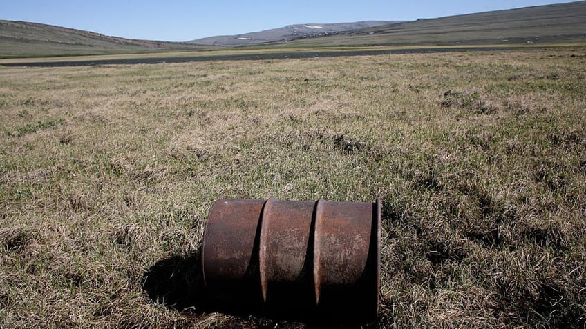 A lone oil barrel is pictured near the Kokalik river, which winds through the National Petroleum Reserve in northern Alaska. (Andrew Lichtenstein/Corbis via Getty Images)