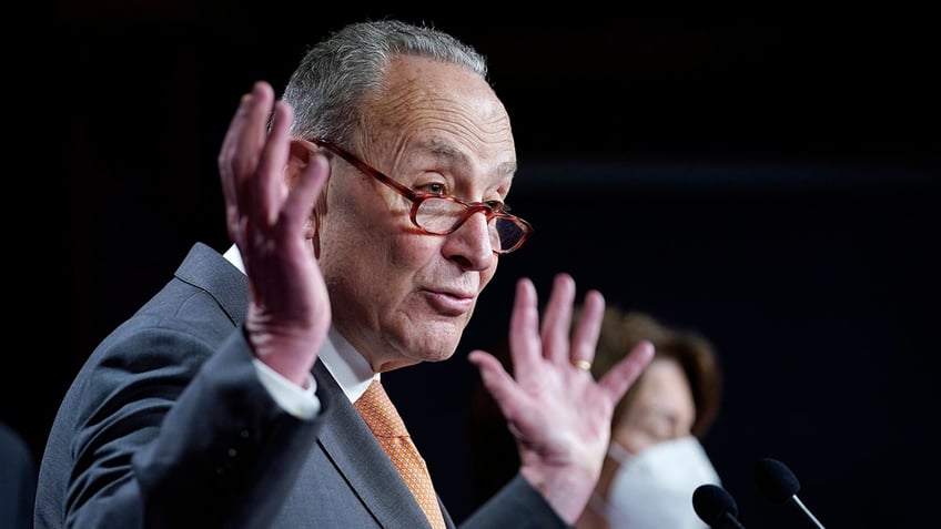 Chuck Schumer gesturing with hands up