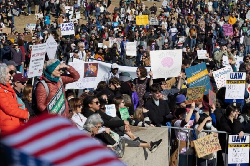 Demonstrators take part in a Stand Up For Science rally at the Lincoln Memorial in Washing