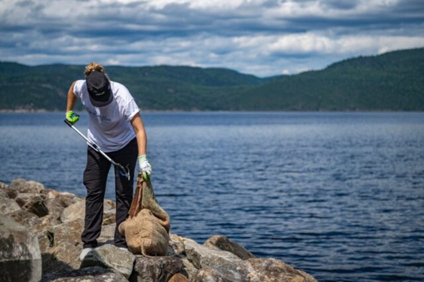 Viridiana Jimenez, a marine biologist with Reseau Quebec Maritime, collects trash near L'A