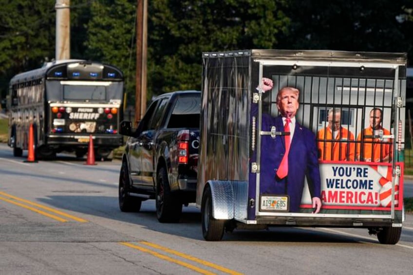 scores of trump supporters show support outside georgia jail ahead of his expected surrender