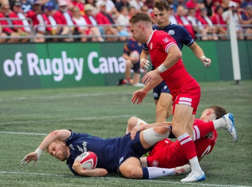 Scotland's Gus Warr scores a try against Canada in his debut match for his national team i