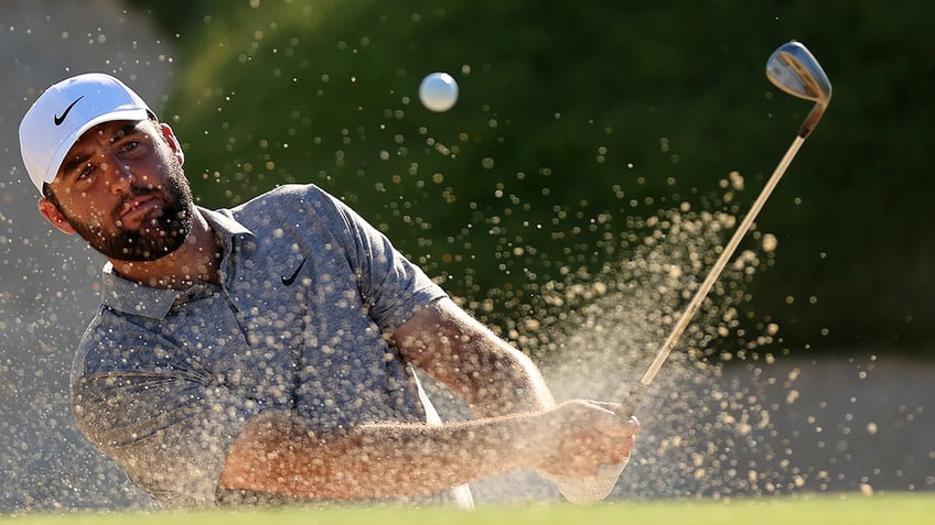 Scottie Scheffler hits bunker shot