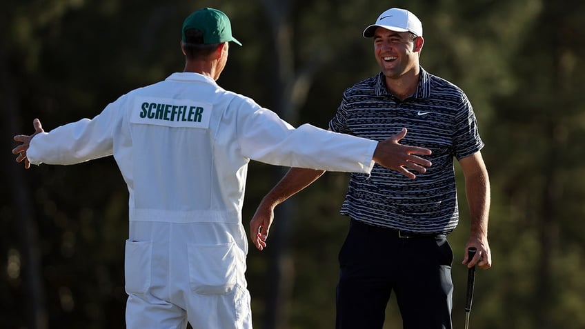 Scottie Scheffler celebrates