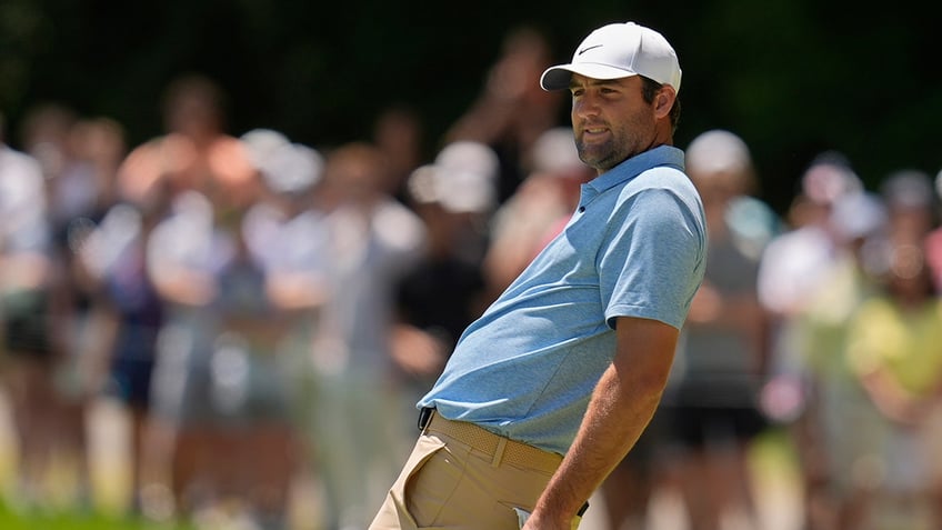 Scottie Scheffler misses a putt