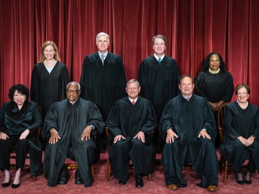 Washington, DC - October 7 : Members of the Supreme Court sit for a group photo following
