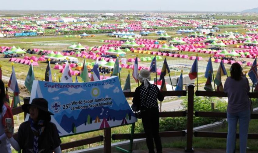 scouting body asks south korea to cut jamboree short as heat wave prompts exodus of british scouts