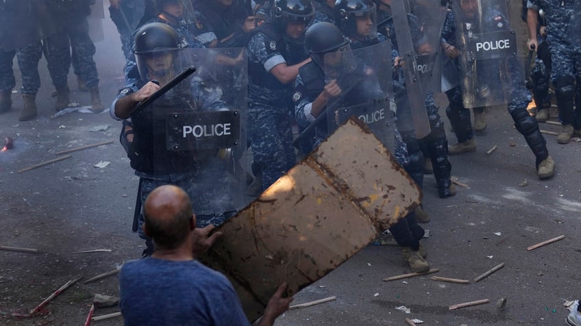 scuffle between lebanese armenians riot police erupts outside azerbaijani embassy