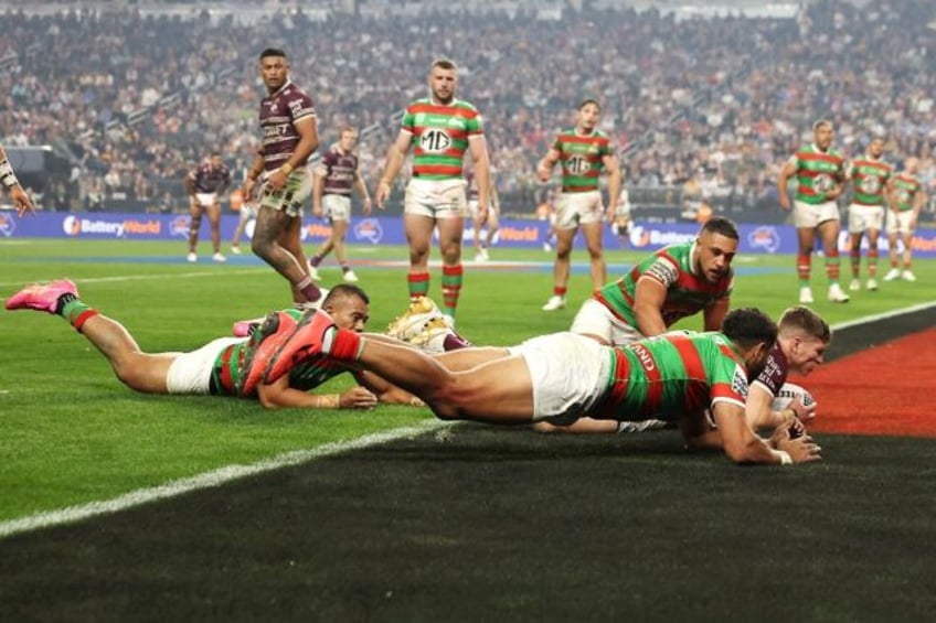 Reuben Garrick of the Manly Sea Eagles scores a try against South Sydney Rabbitohs in fro