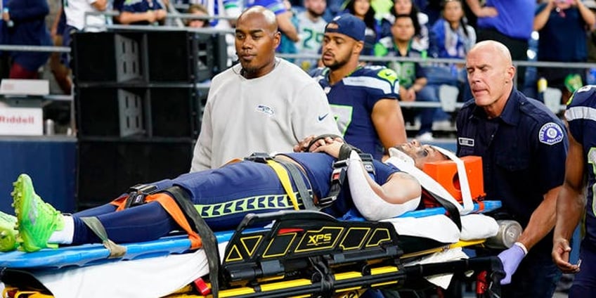 seahawks cade johnson carted off the field hospitalized after likely sustaining concussion in preseason game