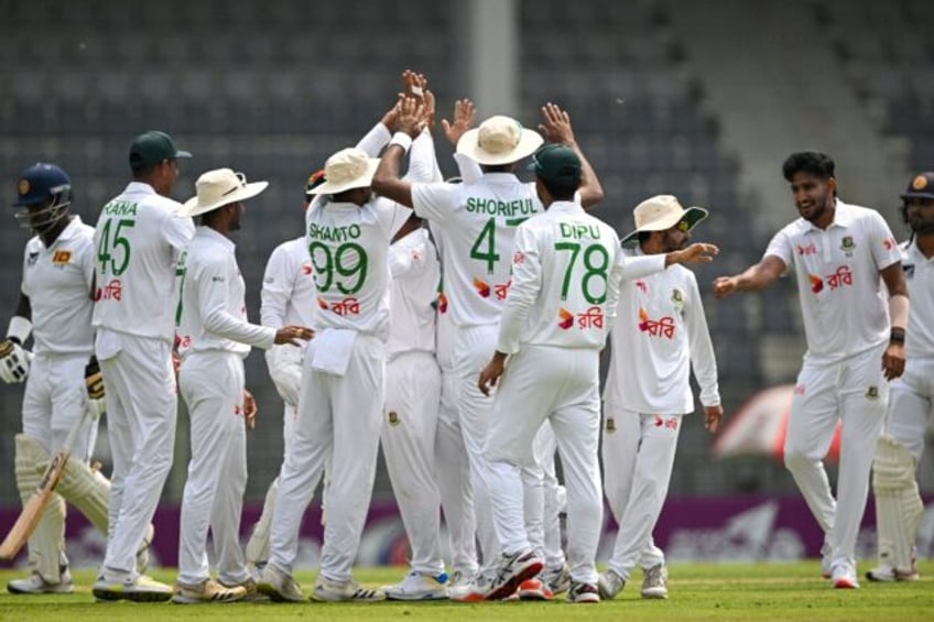 Bangladesh's players celebrate the dismissal of Sri Lanka's Angelo Mathews
