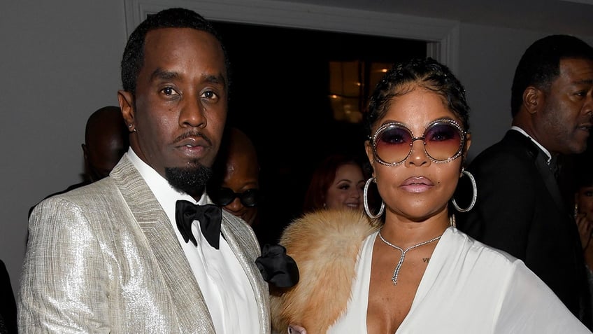 Sean "Diddy" Combs and Misa Hylton posing together