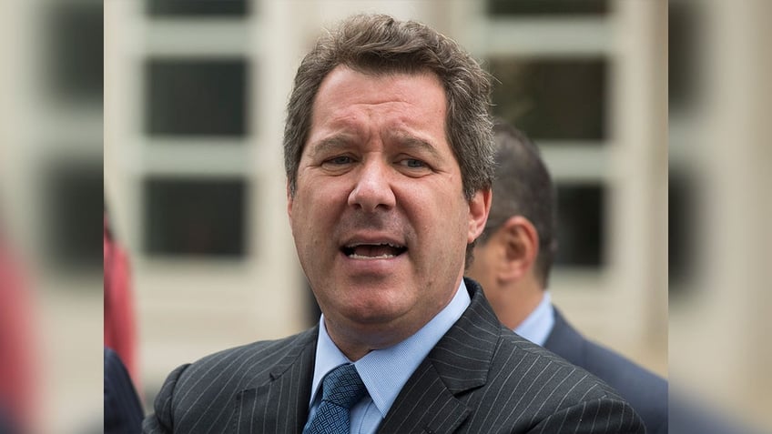 Jeffrey Lichtman in a suit speaking outside court