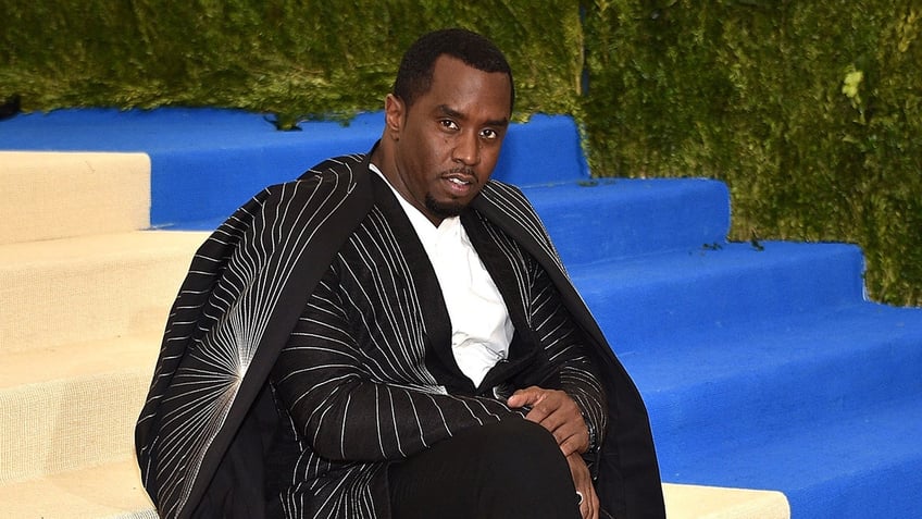 Rapper Sean Diddy Combs wears black suit at the MET Gala.