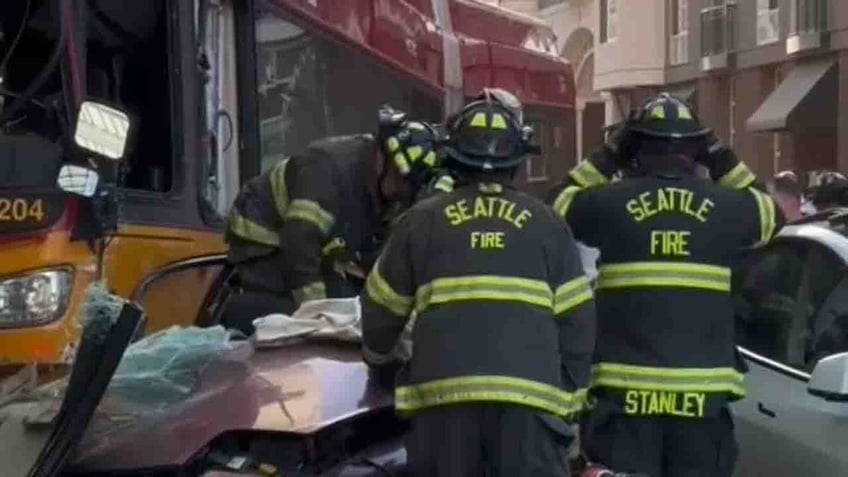 seattle bus crashes into building killing pedestrian and injuring 12