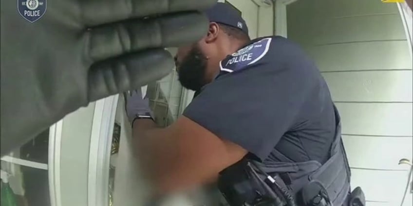 seattle police arrest burglary suspect found chugging gasoline in victims garage bodycam video shows