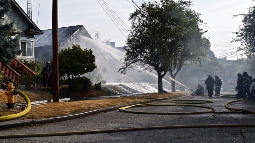 seattle police find 4 people dead after house fire investigating causes of death whether blaze was set