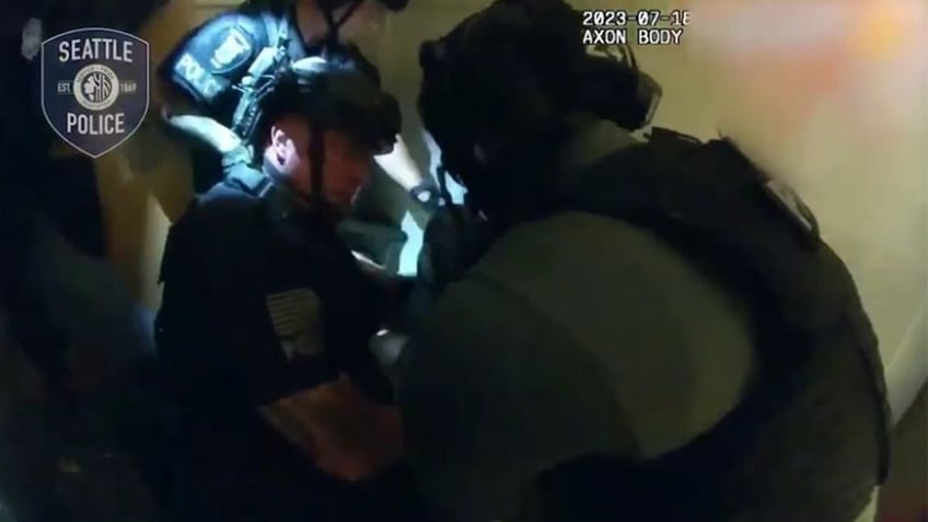 seattle swat team rescues hostage women from naked man in raid caught on bodycam video