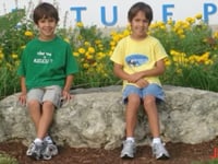 SeaWorld enthusiasts and twin brothers who attended summer camp as kids work at park for milestone anniversary