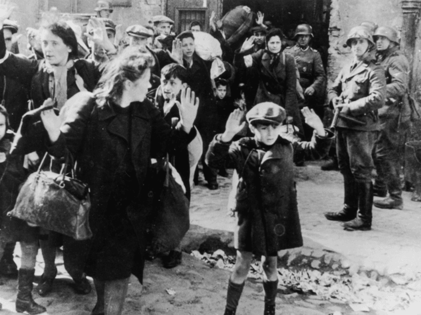 Jews from the Warsaw ghetto surrender to German soldiers after the Warsaw Ghetto Uprising of April-May 1943. On the right is SS Josef Blösche (1912 - 1969). (Photo by Keystone/Hulton Archive/Getty Images)