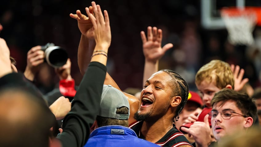 South Carolina players celebrate with students