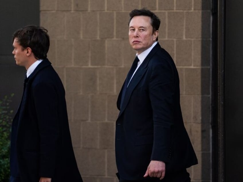 Elon Musk looks nonplussed in black