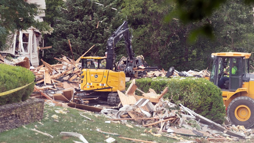 Crew workers remove debris