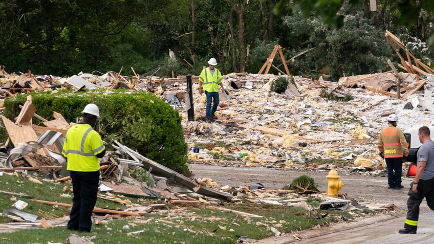 Crew workers remove debris