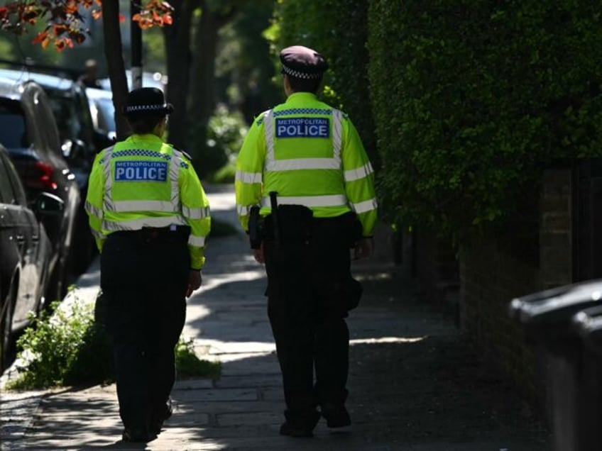 Police officers patrol outside the home of British Prime Minister Keir Starmer in London o