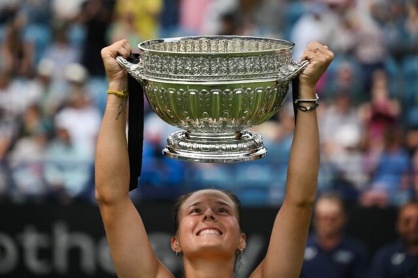 Champion's joy: Russia's Daria Kasatkina lifts the trophy after defeating Canada's Leylah