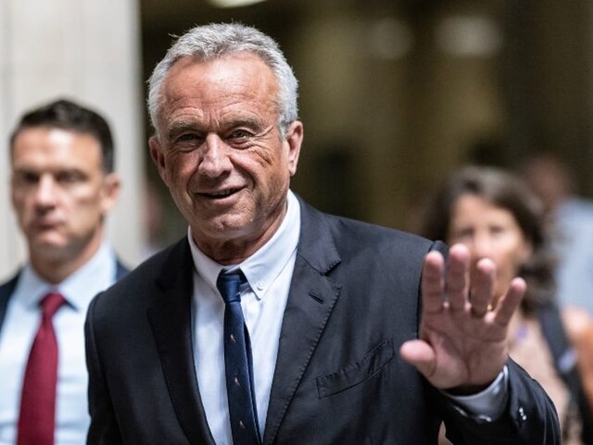 Independent presidential candidate Robert F. Kennedy Jr., waves to the media outside the N