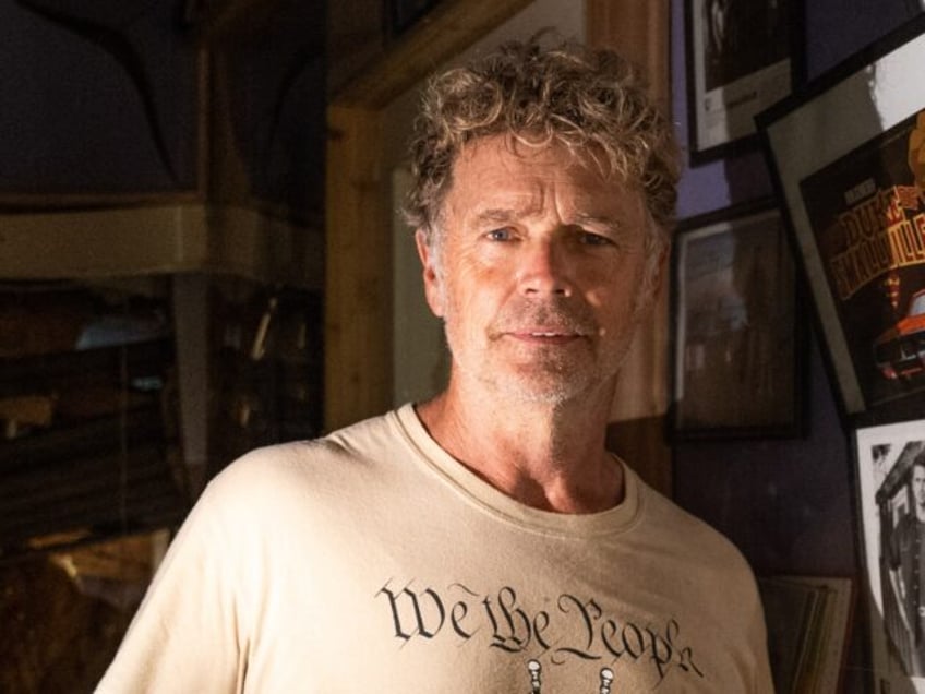 HOLDEN, LA - SEPTEMBER 2: Actor John Schneider, known for his role as Bo Duke in "The Dukes of Hazzard" television series, stands inside his studio that was damaged by Hurricane Ida on September 2, 2021 in Holden, Louisiana. Ida made landfall as a Category 4 hurricane Sunday in Louisiana, …