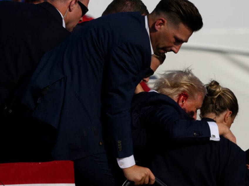 BUTLER, PENNSYLVANIA - JULY 13: Secret Service agents surround Republican presidential can