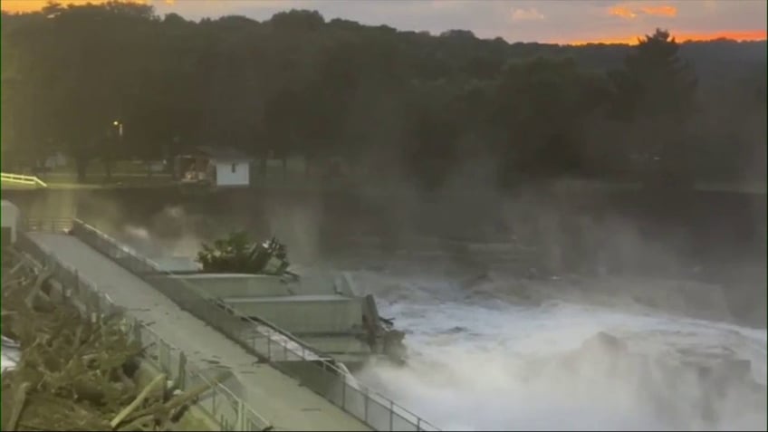 water rushing out of dam