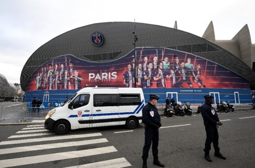 Police stand guard outside the Parc des Princes in Paris where Paris Saint-Germain will fa