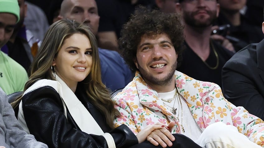 Selena Gomez and Benny Blanco attend a basketball game