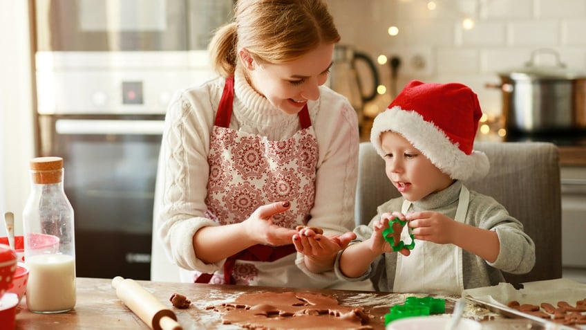 mother and son making cookies