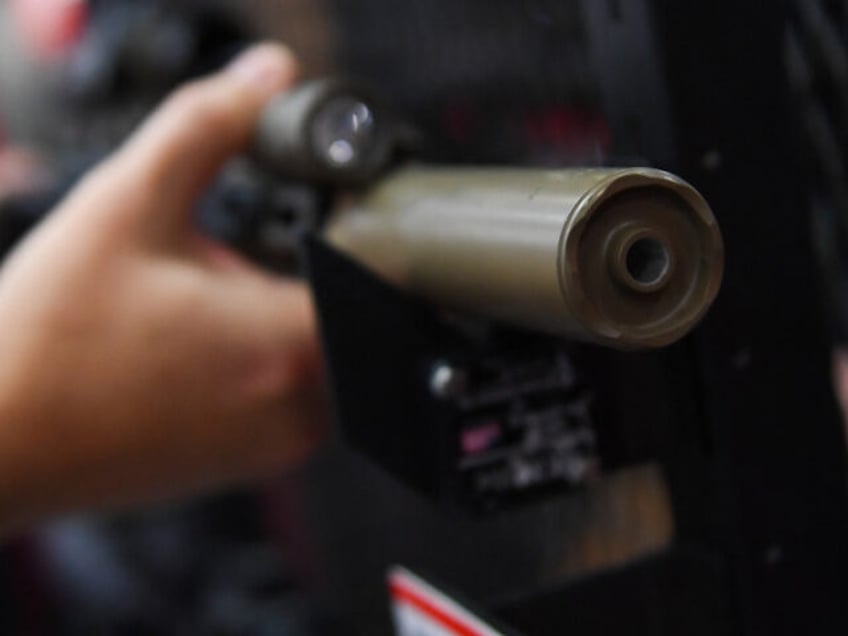 A SureFire firearm sound suppressors, commonly referred to as a silencer, is displayed dur