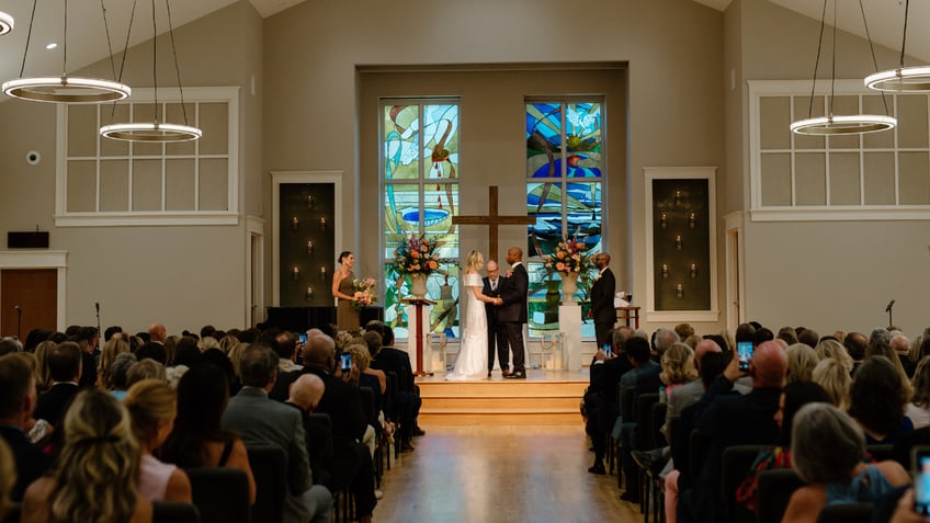 Tim Scott and Mindy Noce at altar