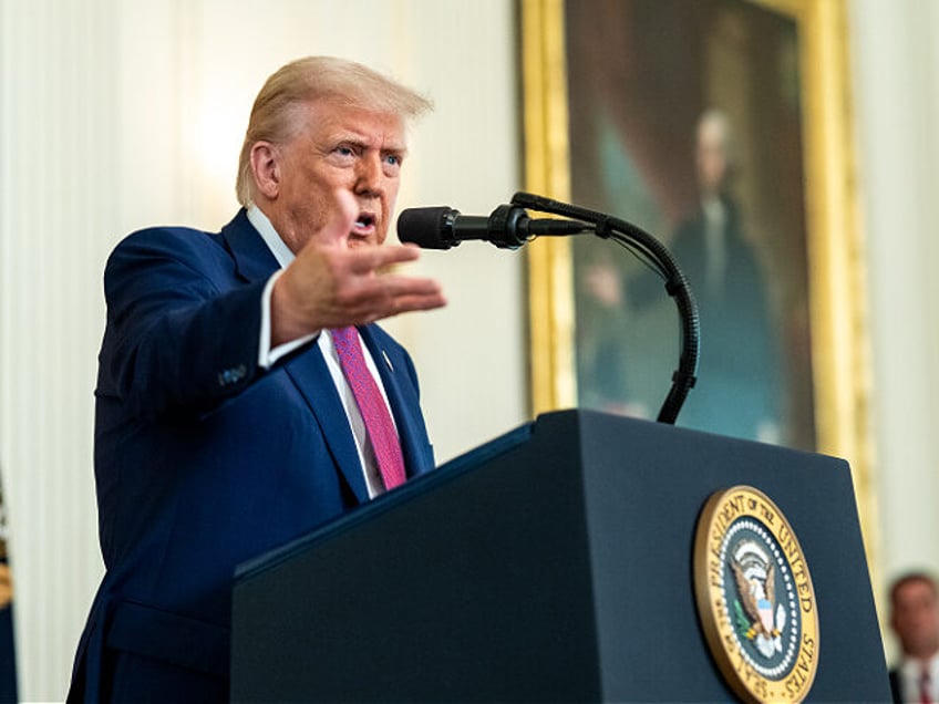 President Donald Trump answers questions from the press after signing 3 bills supporting t