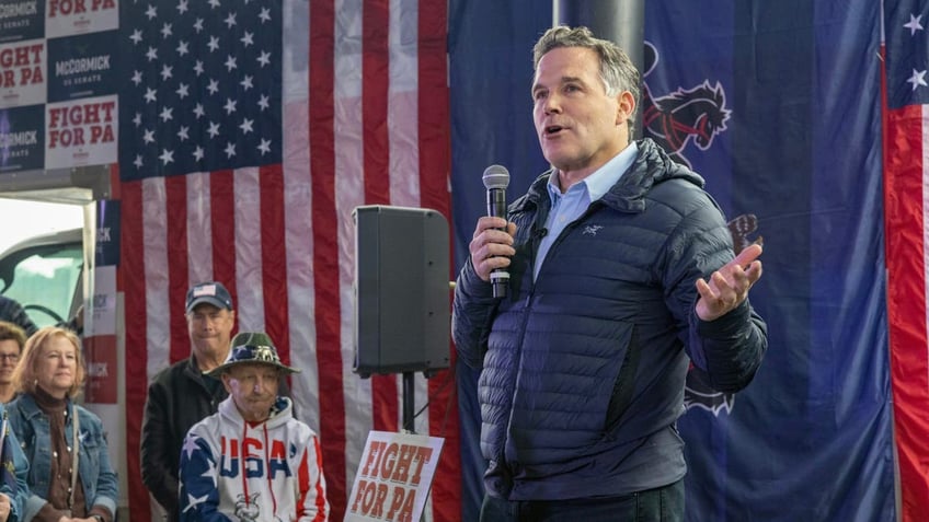 Dave McCormick at campaign appearance holding microphone