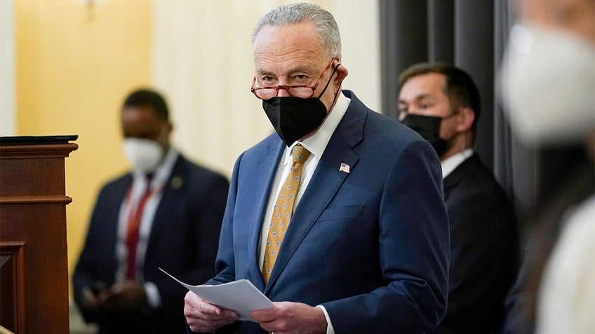 Senate Majority Leader Chuck Schumer of N.Y., waits to speak during an event to mark one year since the U.S. Capitol insurrection on Capitol Hill in Washington, Jan. 6, 2022. 