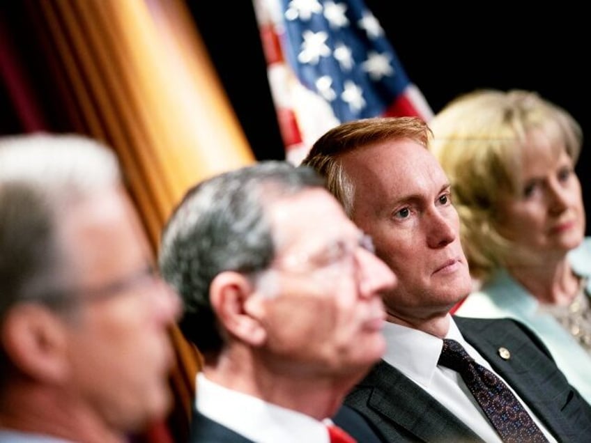 (L-R) Senator John Thune (R-SD), Senator John Barrasso (R-WY), Senator James Lankford (R-OK), and Senator Cindy Hyde-Smith (R-MS) listen during a news conference on Title 42 at the US Capitol in Washington, DC, on April 27, 2022. - The public health order was first issued in early 2020 under the …