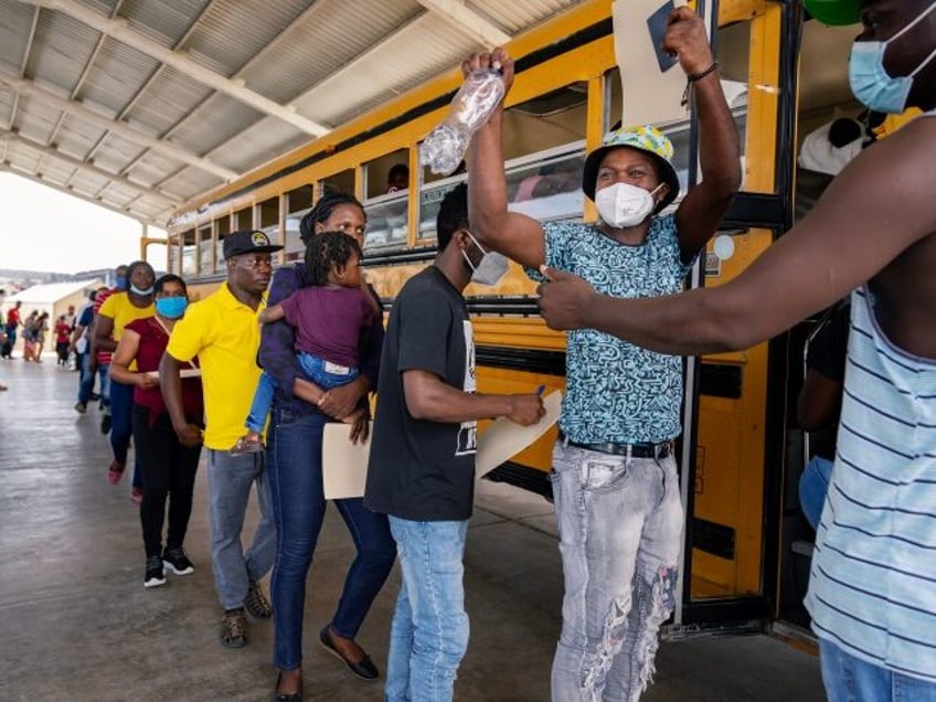 REYNOSA, MEXICO - AUGUST 30: Migrants gather outside a legal training session inside Reyno