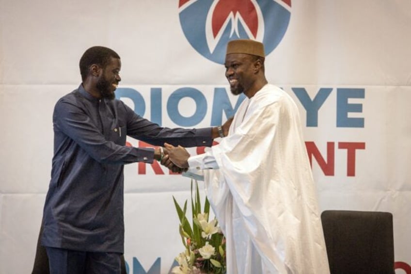 Ousmane Sonko (R) and Bassirou Diomaye Faye (L) during a press conference in Dakar on Marc